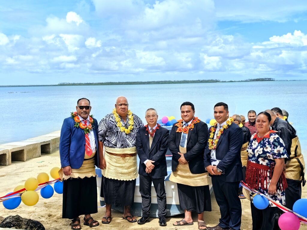 Mr. Ruan Dewen, Hon. Lanumata and Hon. Lauaki with members of the village of Talafo'ou during the boat handover ceremony.