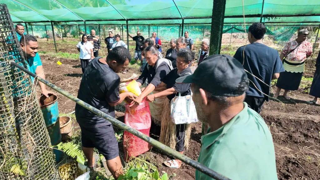 Farmer participants learning organic farming techniques first hand.