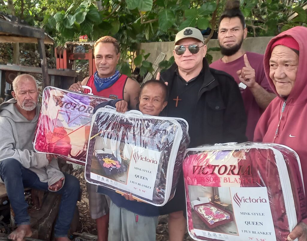 Local Christian fellowship leader, ZCO Hapa, distributes winter blankets to those in need within his community. Photo Zco Vileti Tuipulotu Hapa