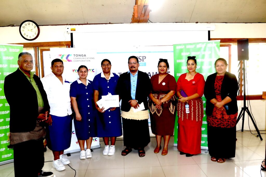 Dr Robin Havea, USP Tonga Campus Director (middle) with Viliami Tei, TCC Marketing Manager (left) and the TNU team that won first prize. Photo: USP Tonga