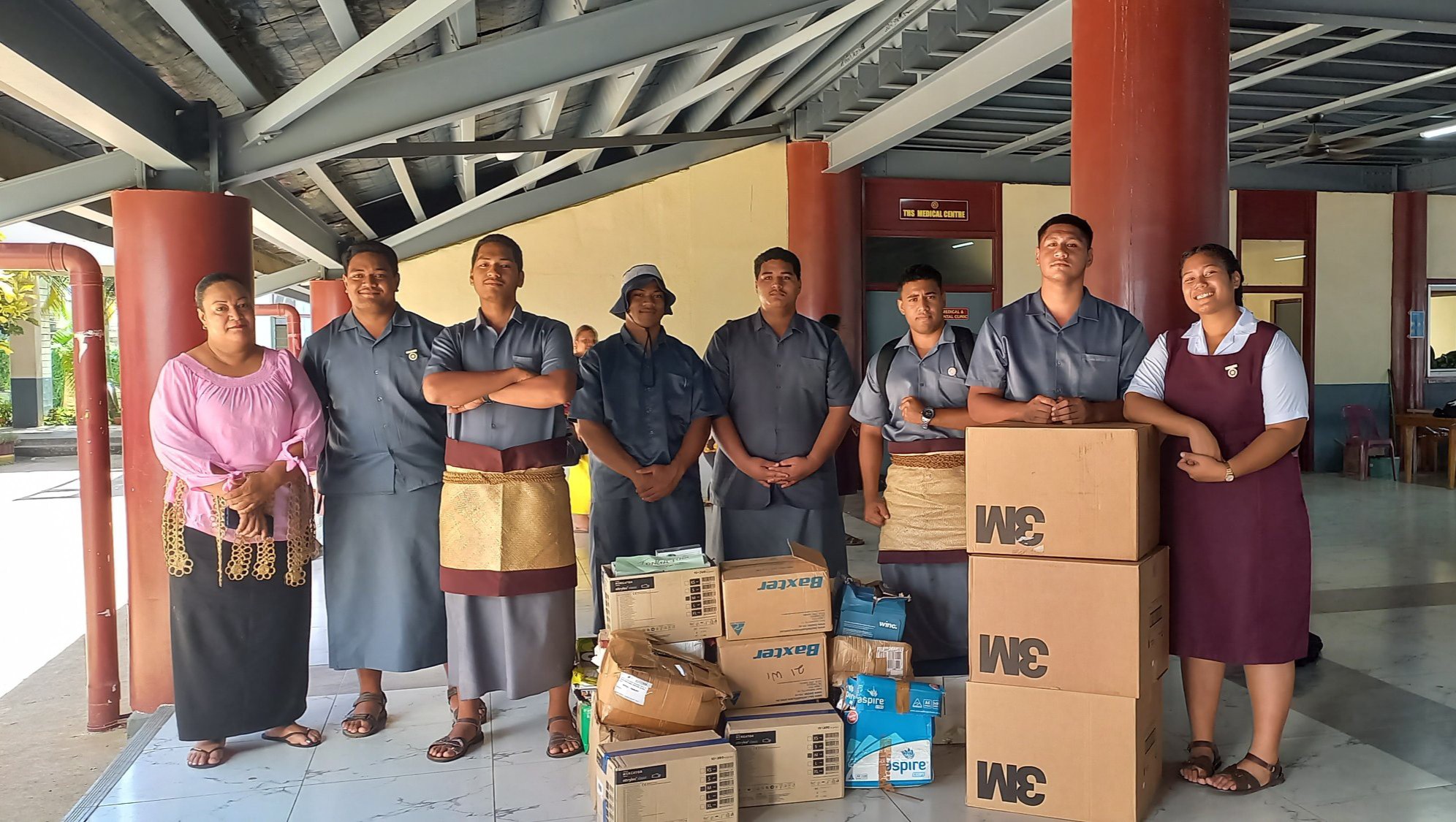 Queen’s Charity donates books, medical supplies to Tonga High