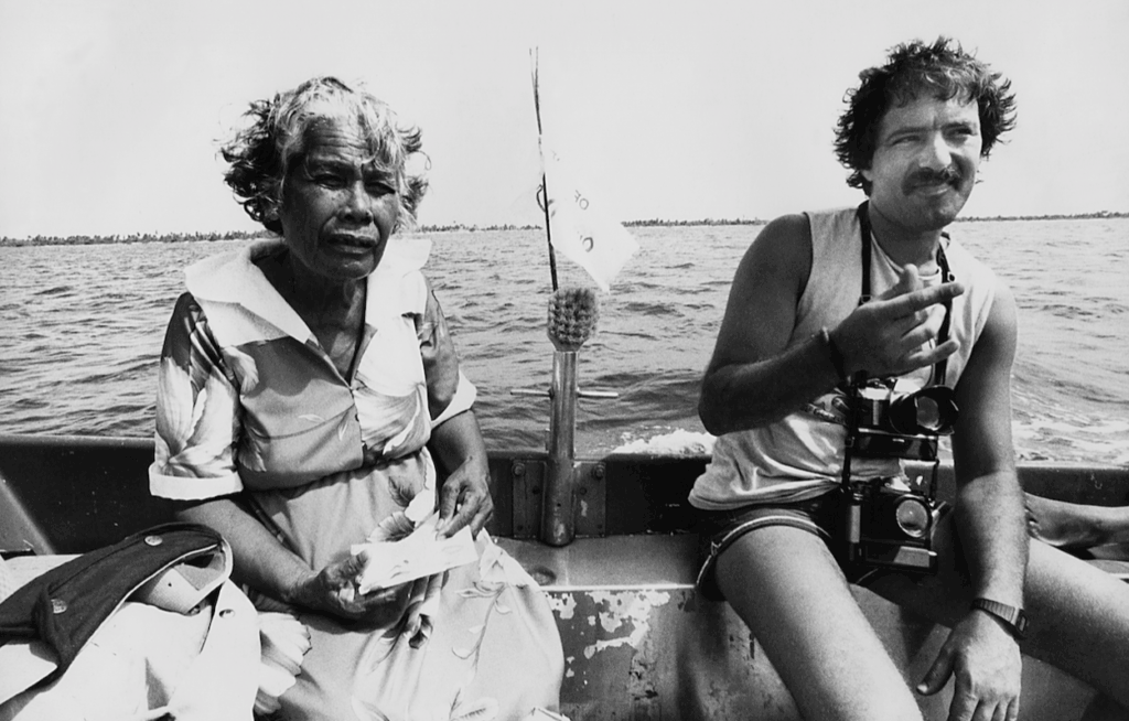 Greenpeace photographer Fernando Pereira being welcomed at Rongelap atoll in May 1985, weeks before he was killed by French secret agents who bombed the Rainbow Warrior in Auckland Harbour to prevent the ship protesting at Moruroa atoll in French Polynesia 